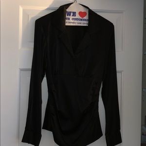 Black silk stretch long sleeve side zip blouse.